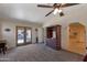 Main bedroom featuring carpet, vaulted ceilings, and access to the patio at 350 E Huber St, Mesa, AZ 85201
