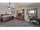 Main bedroom with brick fireplace, vaulted ceiling and sitting area at 350 E Huber St, Mesa, AZ 85201