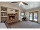 Main bedroom with brick fireplace, vaulted ceiling and backyard access at 350 E Huber St, Mesa, AZ 85201