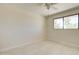 Bedroom featuring a ceiling fan and a bright window at 35019 N Central Ave, Phoenix, AZ 85086