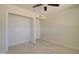 Bedroom with large closet, ceiling fan, and natural light at 35019 N Central Ave, Phoenix, AZ 85086