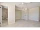 Bedroom with open bathroom, white ceiling fan and neutral walls at 35019 N Central Ave, Phoenix, AZ 85086