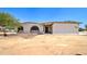 Home featuring a stucco exterior, arched windows, and desert landscaping in a tranquil setting at 35019 N Central Ave, Phoenix, AZ 85086