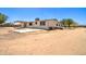 Exterior view showcasing the rear of home, featuring covered patio, desert landscaping, and spacious lot at 35019 N Central Ave, Phoenix, AZ 85086