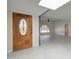 Foyer with decorative wood front door and a view of the living room at 35019 N Central Ave, Phoenix, AZ 85086