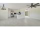 Open kitchen with white cabinetry, stainless appliances, and tile flooring at 35019 N Central Ave, Phoenix, AZ 85086