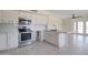 Modern kitchen with stainless steel appliances and tile flooring at 35019 N Central Ave, Phoenix, AZ 85086