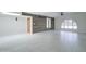 Bright and spacious living room with statement wood wall and tile flooring at 35019 N Central Ave, Phoenix, AZ 85086