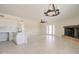 Open-concept living area showcases fireplace and access to kitchen and backyard at 35019 N Central Ave, Phoenix, AZ 85086