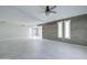 Large, bright living room featuring a ceiling fan and modern tile floors at 35019 N Central Ave, Phoenix, AZ 85086
