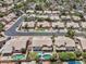 An aerial view shows a well-maintained neighborhood with houses, tree-lined streets and private pools at 3580 W Dublin St, Chandler, AZ 85226