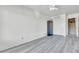 A bedroom with vinyl floors, a ceiling fan, and white painted walls and trim at 3580 W Dublin St, Chandler, AZ 85226