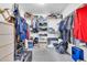 Walk-in closet providing generous storage solutions with shelves, hanging rods, and plenty of space for organization at 3580 W Dublin St, Chandler, AZ 85226