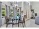 Bright dining area featuring a glass-top table with seating for four, plus outdoor views at 3580 W Dublin St, Chandler, AZ 85226