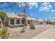 Well-maintained single-Gathering home showcasing desert landscaping, a tile roof, and an attached two-car garage at 3580 W Dublin St, Chandler, AZ 85226