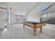 Spacious game room with a pool table, carpet flooring, neutral colors, and natural light at 3580 W Dublin St, Chandler, AZ 85226
