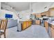 Open kitchen with a breakfast bar and stainless steel appliances, blending seamlessly with the living area at 3580 W Dublin St, Chandler, AZ 85226
