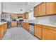 Functional kitchen featuring stainless steel appliances, tile floors, and ample cabinet space at 3580 W Dublin St, Chandler, AZ 85226