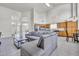 Spacious living room with a large sectional sofa, high ceilings, clerestory windows, and easy access to kitchen at 3580 W Dublin St, Chandler, AZ 85226