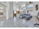 Bright living room with an open layout, high ceilings, tile floors, and natural light from large windows at 3580 W Dublin St, Chandler, AZ 85226