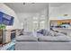 Bright living area featuring a large sectional, fireplace, high ceilings, and an adjacent study area at 3580 W Dublin St, Chandler, AZ 85226
