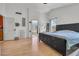 Spacious main bedroom featuring wood floors, natural light, and private ensuite bathroom access at 3580 W Dublin St, Chandler, AZ 85226