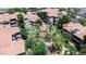 Aerial view of apartments featuring lush green spaces, mature trees, and well-maintained landscaping at 3830 E Lakewood E Pkwy # 2126, Phoenix, AZ 85048