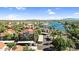 Scenic aerial view of a lakeside condo community with red tile roofs and lush landscaping at 3830 E Lakewood E Pkwy # 2126, Phoenix, AZ 85048