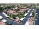 An aerial view of a condo community highlighting the parking, landscaping, and building exteriors at 3830 E Lakewood E Pkwy # 2126, Phoenix, AZ 85048