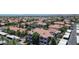 An aerial view of apartments and condos with red tile roofs within a well-maintained neighborhood at 3830 E Lakewood E Pkwy # 2126, Phoenix, AZ 85048