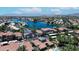 Scenic aerial view of a lakefront condo community showcasing the red tile roofs at 3830 E Lakewood E Pkwy # 2126, Phoenix, AZ 85048