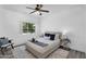 Cozy bedroom with a comfortable bed, plush pillows, stylish rug, and natural light from the window at 3830 E Lakewood E Pkwy # 2126, Phoenix, AZ 85048