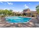 Large community pool with a clear blue water, and comfortable seating for a relaxing day in the sun at 3830 E Lakewood E Pkwy # 2126, Phoenix, AZ 85048