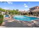 Lounge chairs and palm trees surround the community pool at 3830 E Lakewood E Pkwy # 2126, Phoenix, AZ 85048