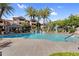 Inviting community pool with a waterfall feature, lounge chairs, and lush landscaping, perfect for relaxation at 3830 E Lakewood E Pkwy # 2126, Phoenix, AZ 85048