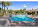 Community pool offers lounge chairs and nearby palm trees at 3830 E Lakewood E Pkwy # 2126, Phoenix, AZ 85048