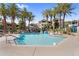 Large community pool with sparkling water, surrounded by palm trees and comfortable lounge chairs for relaxation at 3830 E Lakewood E Pkwy # 2126, Phoenix, AZ 85048