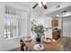 Bright dining area with a view to the kitchen, complete with a wooden table and elegant place settings at 3830 E Lakewood E Pkwy # 2126, Phoenix, AZ 85048