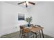 Well-lit dining area featuring a modern table set with seating for four and stylish decor at 3830 E Lakewood E Pkwy # 2126, Phoenix, AZ 85048