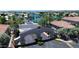 Community entrance with beautiful landscaping, and lush trees near waterfront homes at 3830 E Lakewood E Pkwy # 2126, Phoenix, AZ 85048