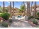 Community hot tub framed by palm trees and lush green landscaping at 3830 E Lakewood E Pkwy # 2126, Phoenix, AZ 85048