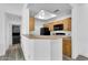 Efficient kitchen with a breakfast bar, updated appliances, and a skylight for abundant natural light at 3830 E Lakewood E Pkwy # 2126, Phoenix, AZ 85048