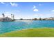 Picturesque lake view showcasing waterfront homes, lush greenery, and shimmering water on a clear, sunny day at 3830 E Lakewood E Pkwy # 2126, Phoenix, AZ 85048
