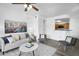 Well-lit living room open to kitchen bar, creating a seamless flow for entertaining and everyday living at 3830 E Lakewood E Pkwy # 2126, Phoenix, AZ 85048