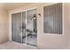 Relax on this patio with views of the interior through glass doors and a serene outdoor ambiance at 3830 E Lakewood E Pkwy # 2126, Phoenix, AZ 85048