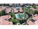 Aerial shot of a pool and spa area nestled within a beautifully maintained community with lush landscaping at 3830 E Lakewood E Pkwy # 2126, Phoenix, AZ 85048