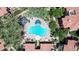 Aerial shot of pool area, surrounded by palm trees, lush landscaping, seating, and other amenities at 3830 E Lakewood E Pkwy # 2126, Phoenix, AZ 85048