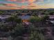 Aerial view of neighborhood with desert landscaping and homes with tile roofs and solar panels at 40123 N Majesty Trl, Anthem, AZ 85086