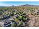 Scenic aerial view of a neighborhood set against mountains and desert landscape, showcasing a serene environment at 40123 N Majesty Trl, Anthem, AZ 85086