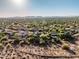 Expansive aerial shot showcasing a vast community in the desert with mountain views, highlighting a peaceful setting at 40123 N Majesty Trl, Anthem, AZ 85086